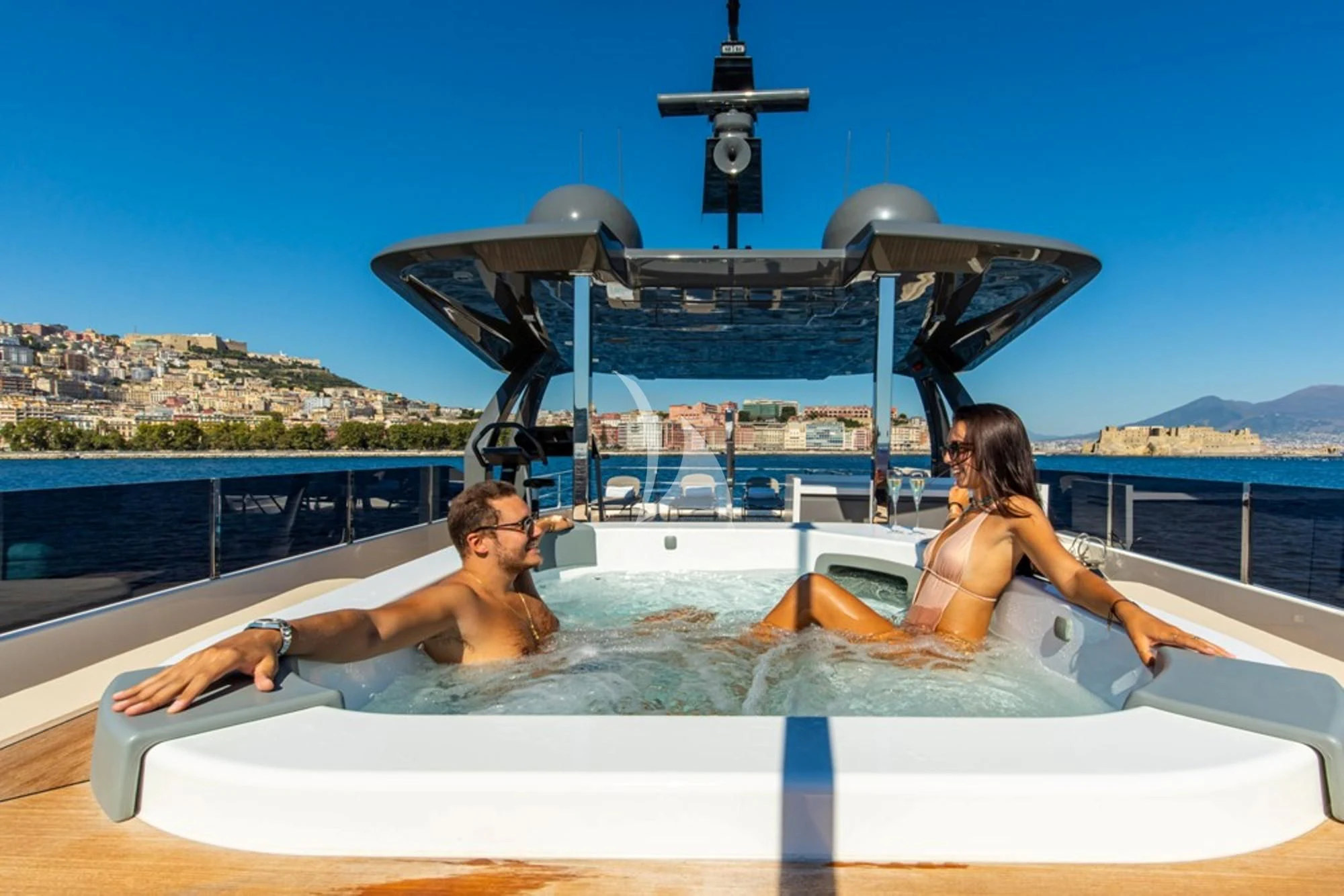 a man and woman sitting on a boat in the water aboard SOUTH Yacht for Sale