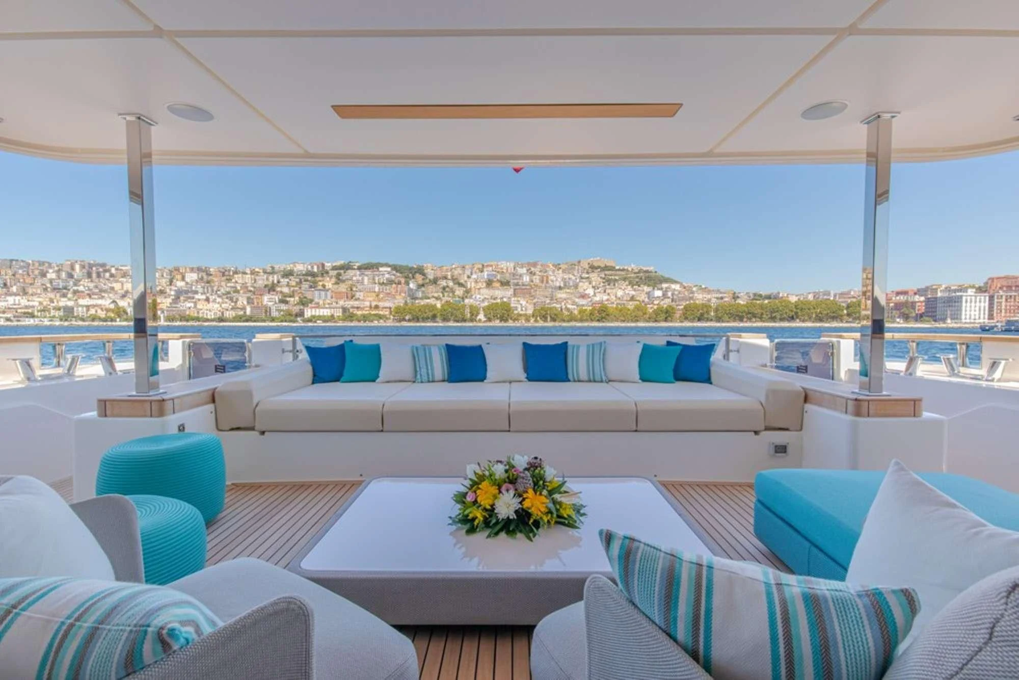 a large living room with a large balcony overlooking a city aboard SOUTH Yacht for Sale