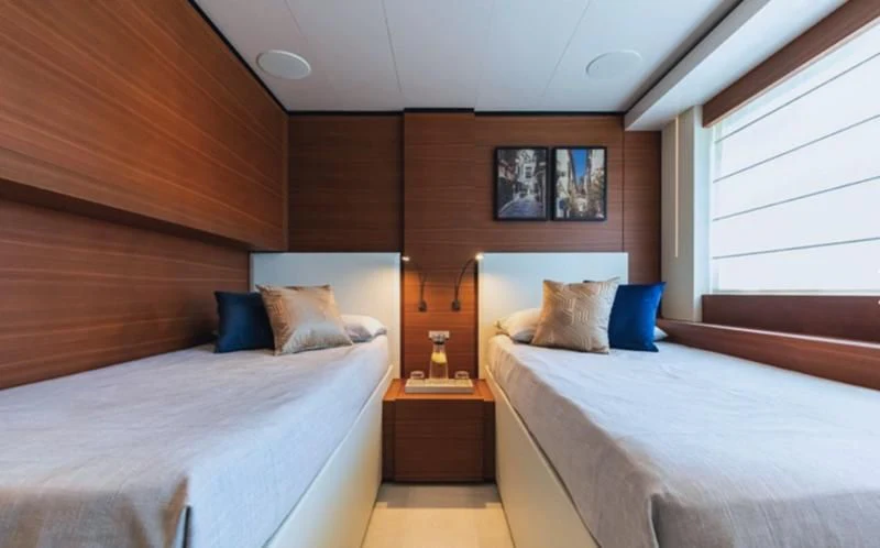a room with two beds aboard SOUTH Yacht for Sale