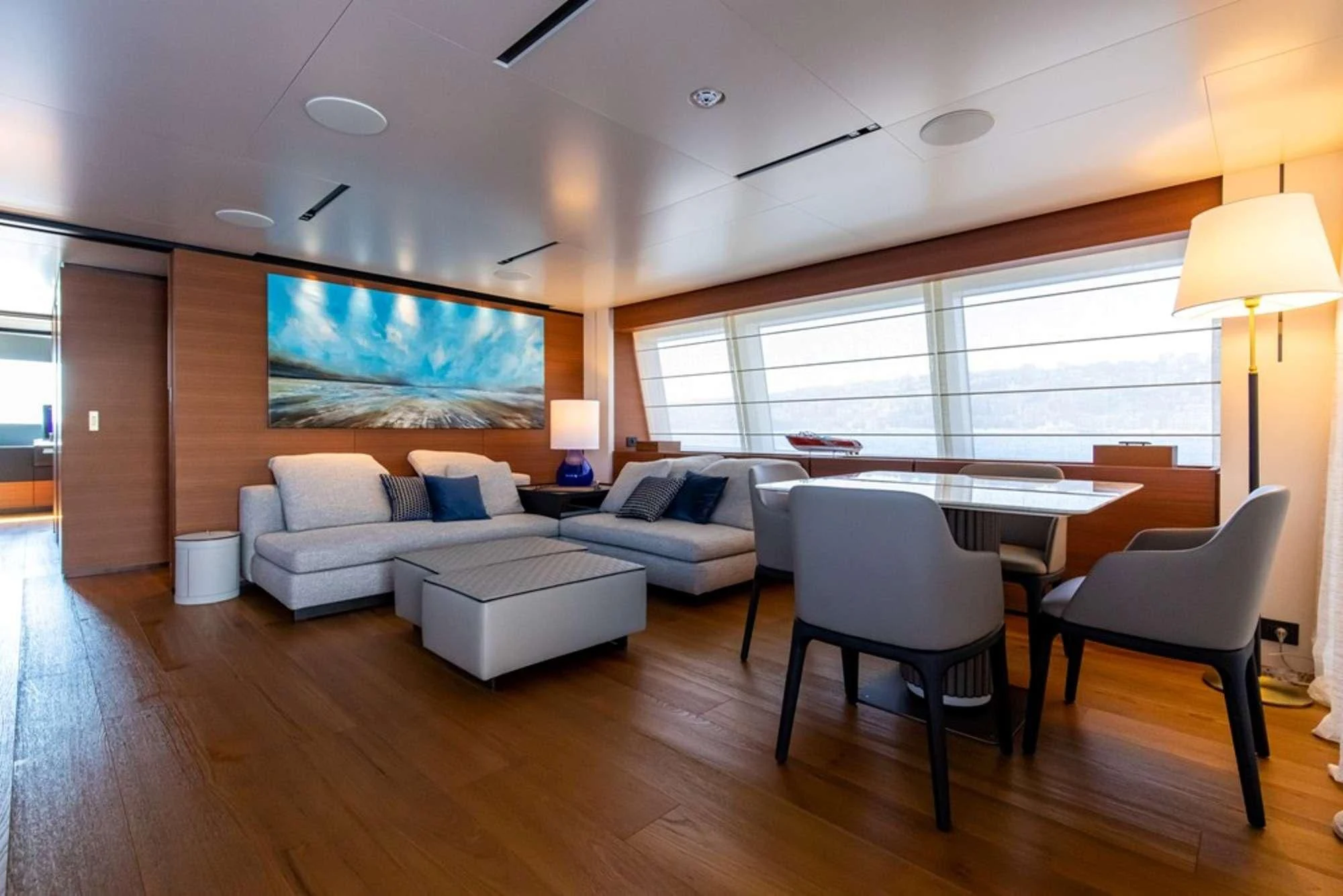 a living room with a large screen aboard SOUTH Yacht for Sale