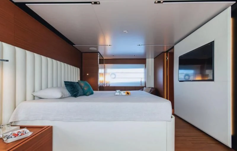 a bedroom with a bed and a television aboard SOUTH Yacht for Sale