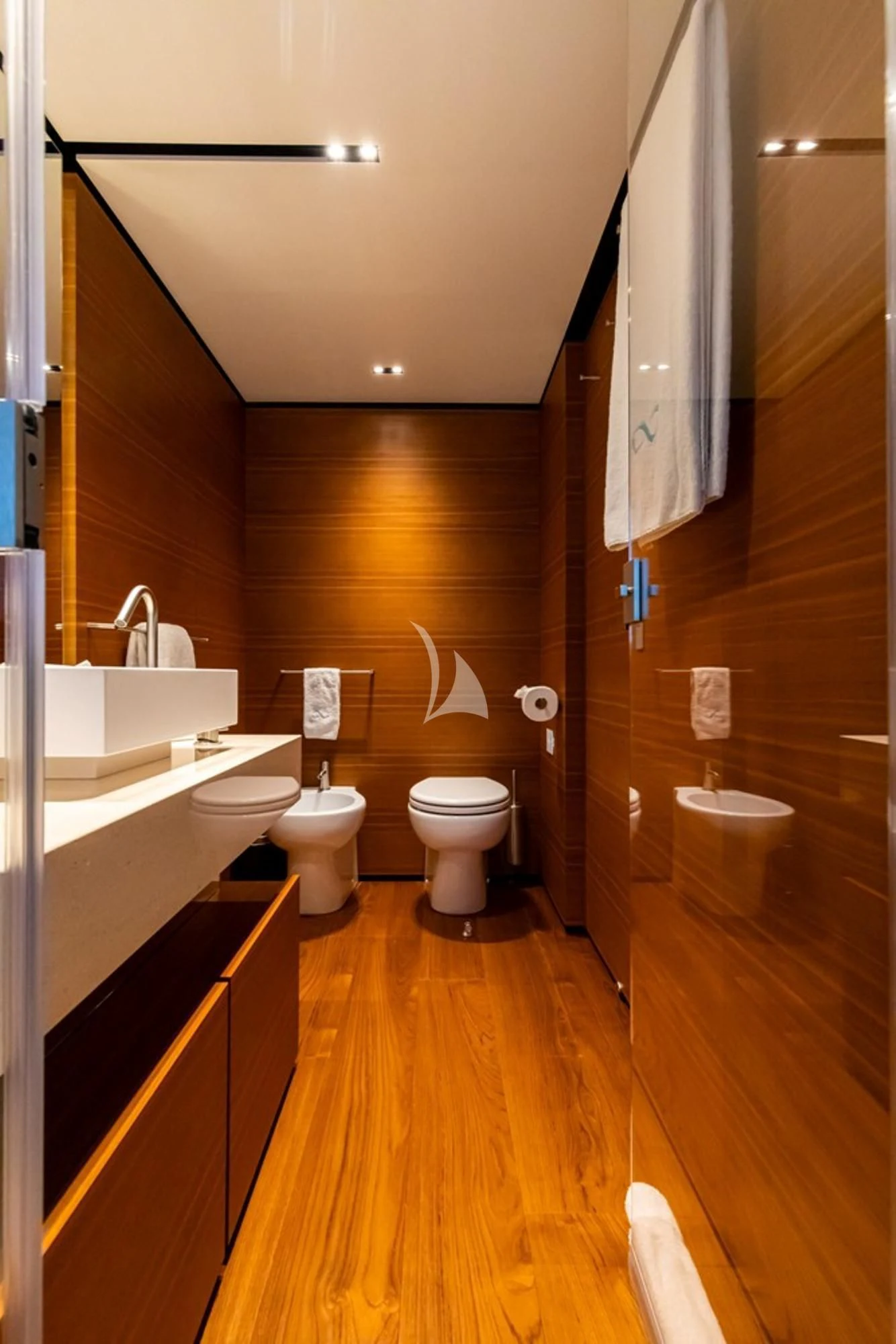a bathroom with a wood floor aboard SOUTH Yacht for Sale