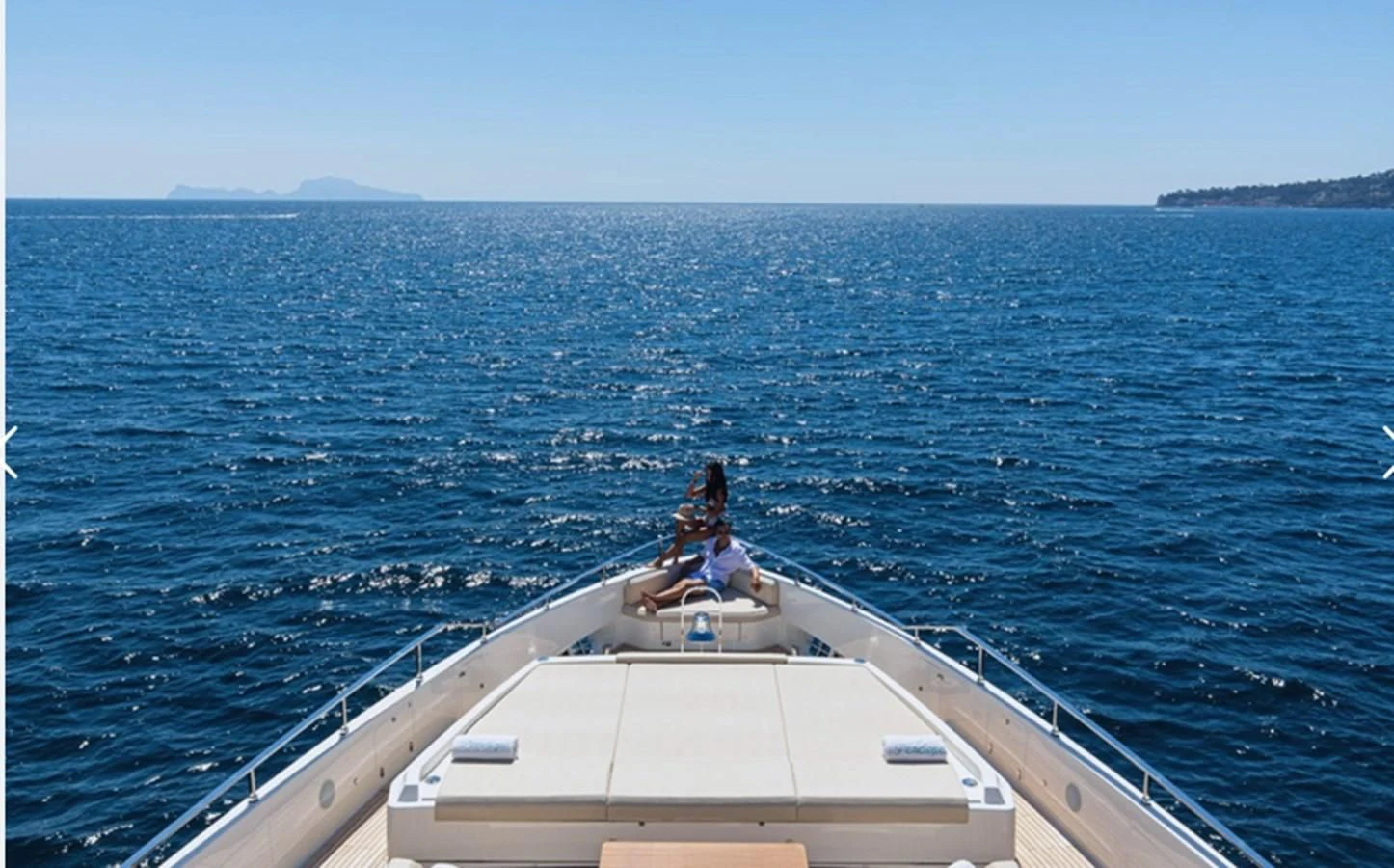two people sitting on a boat aboard SOUTH Yacht for Sale