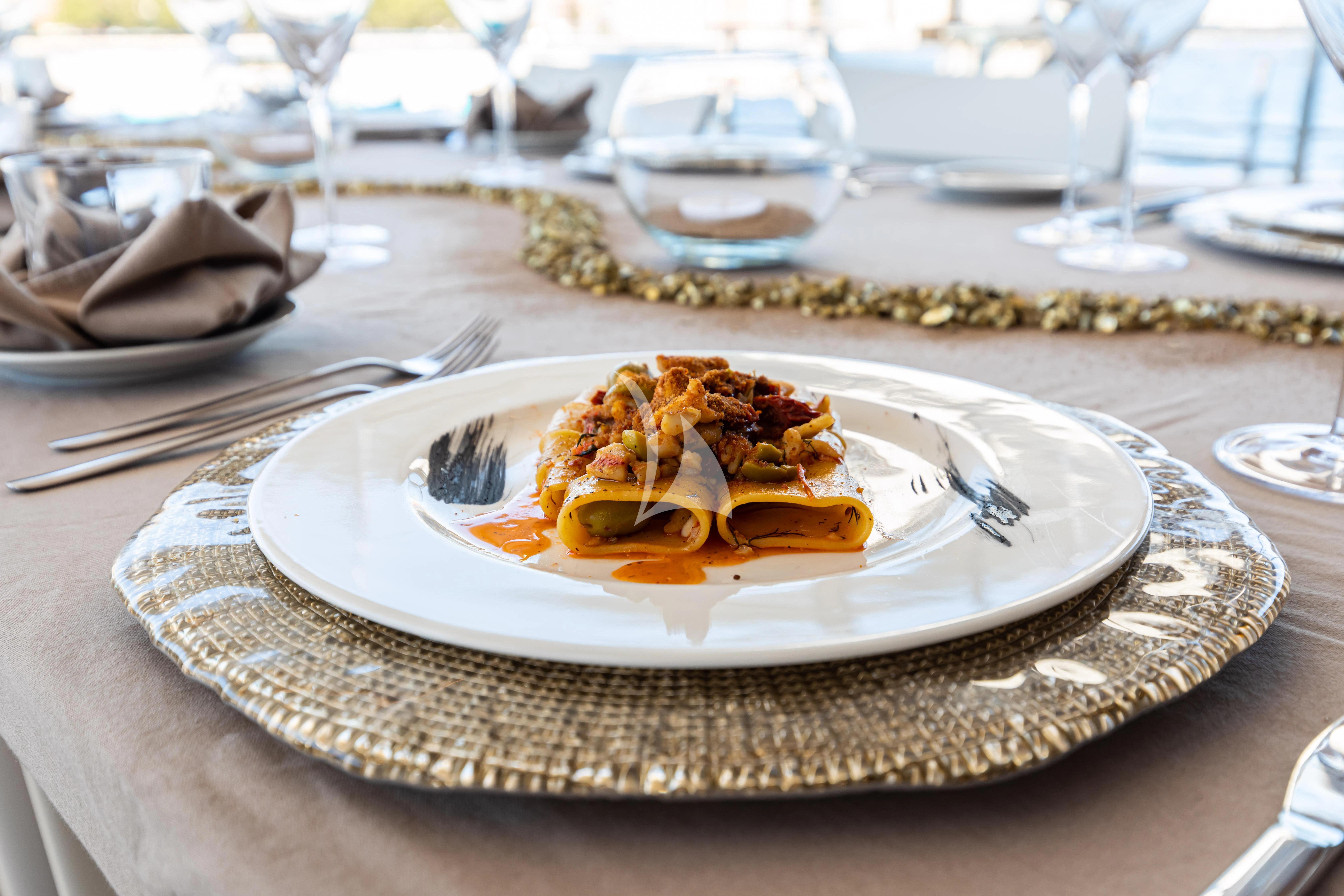 a plate of dessert aboard SOUTH Yacht for Sale
