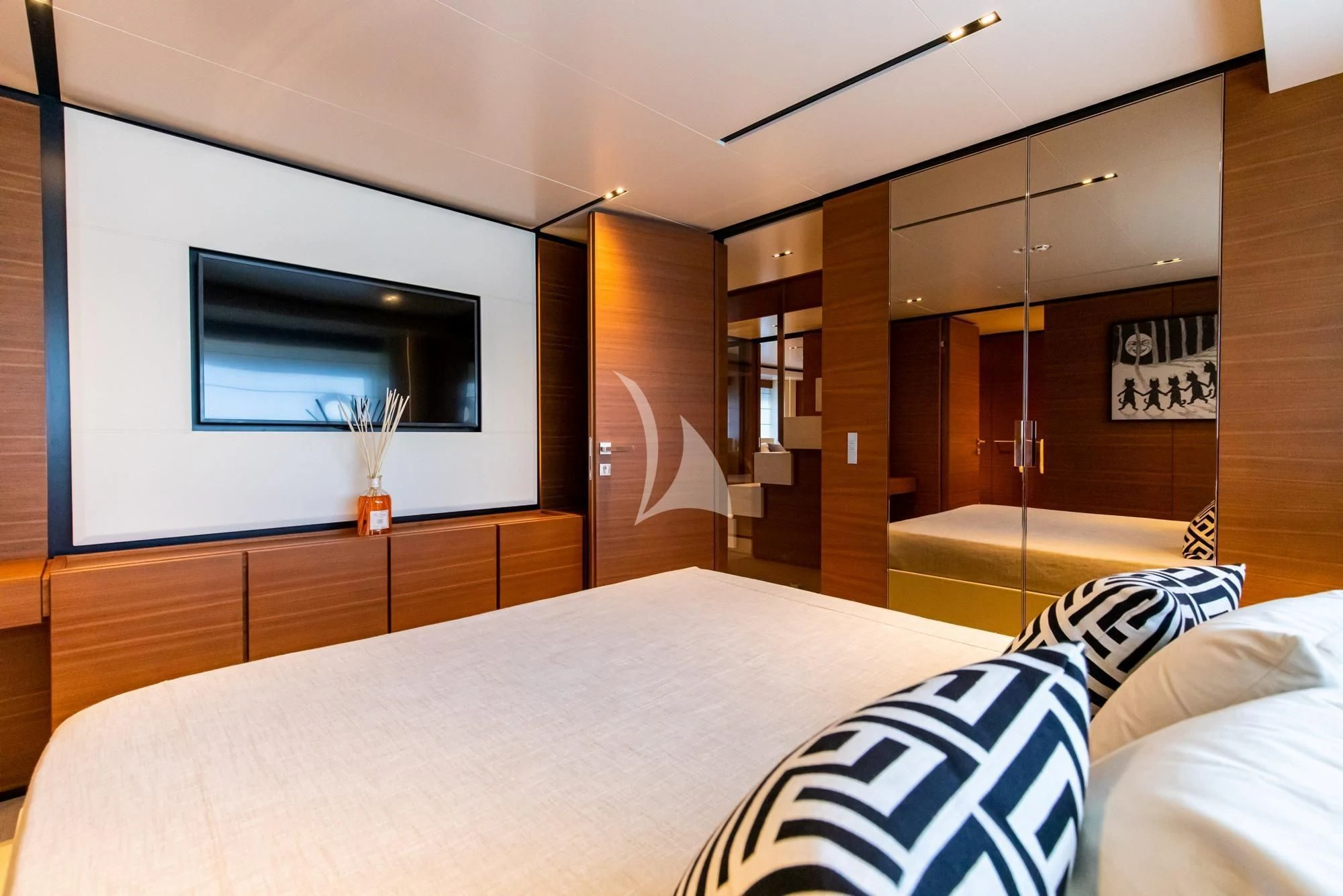 a room with a bed and a television aboard SOUTH Yacht for Sale