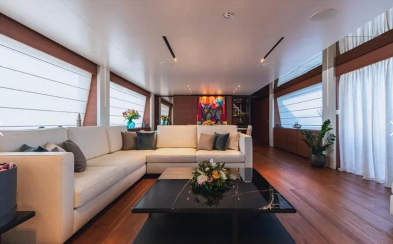 a living room with a couch and a coffee table aboard SOUTH Yacht for Sale