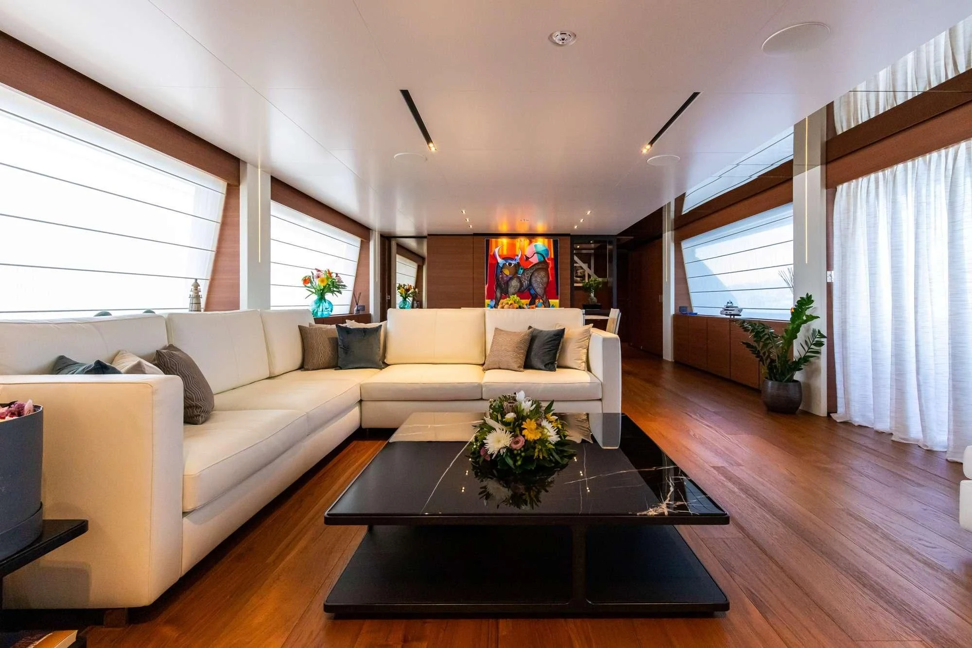 a living room with a couch and coffee table aboard SOUTH Yacht for Sale