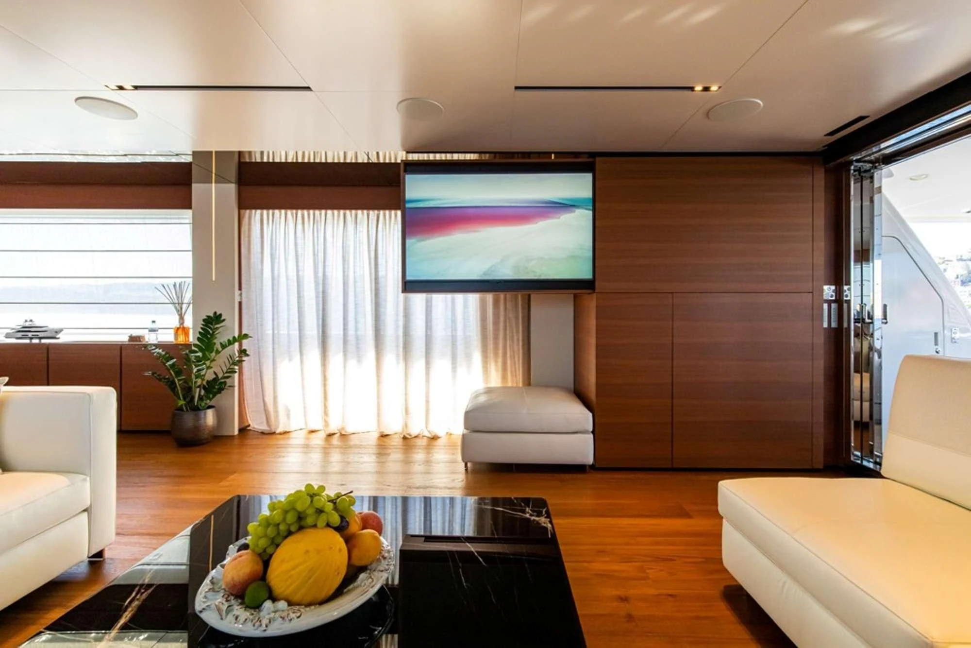 a living room with a table and chairs aboard SOUTH Yacht for Sale