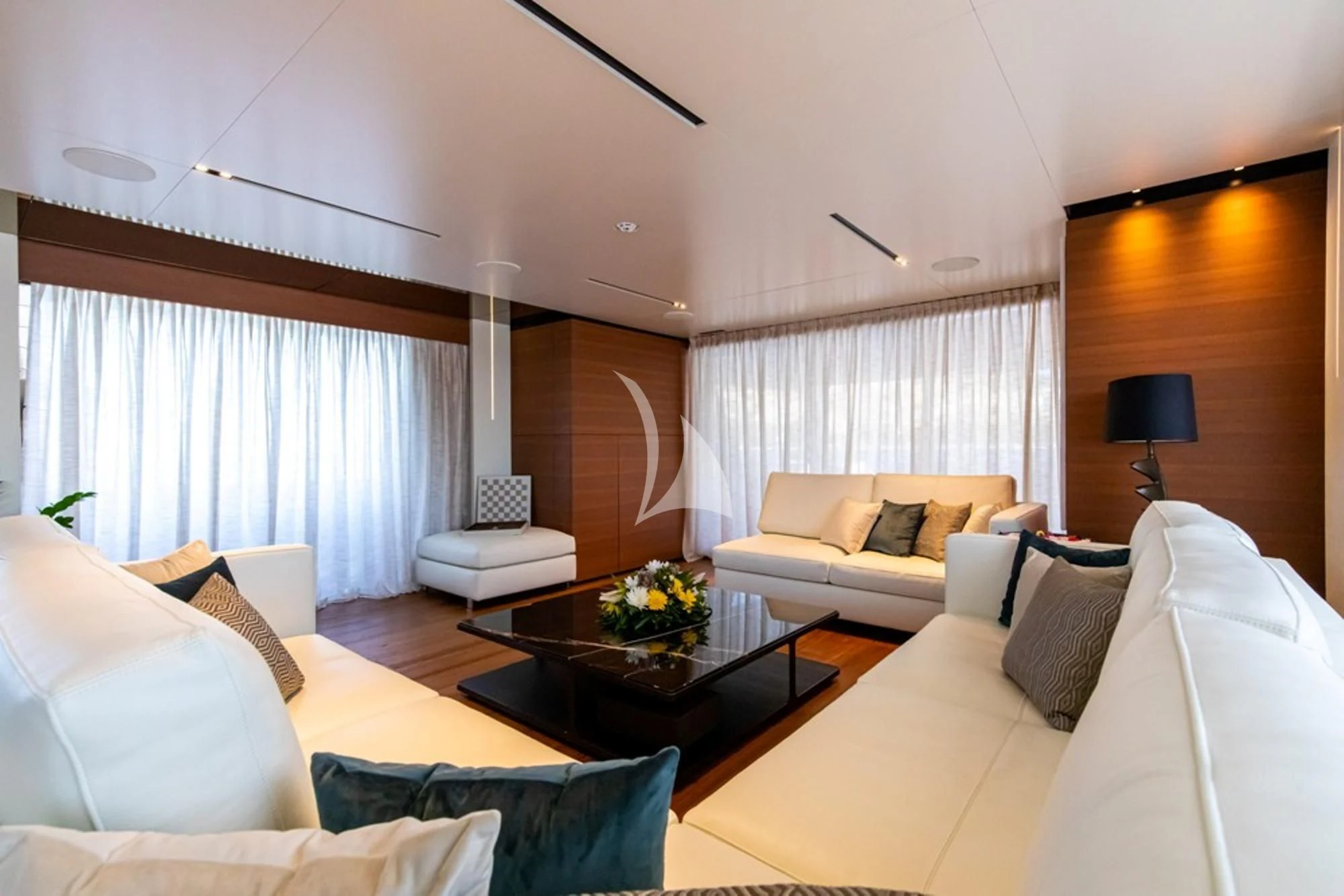 a living room with white couches and a coffee table aboard SOUTH Yacht for Sale