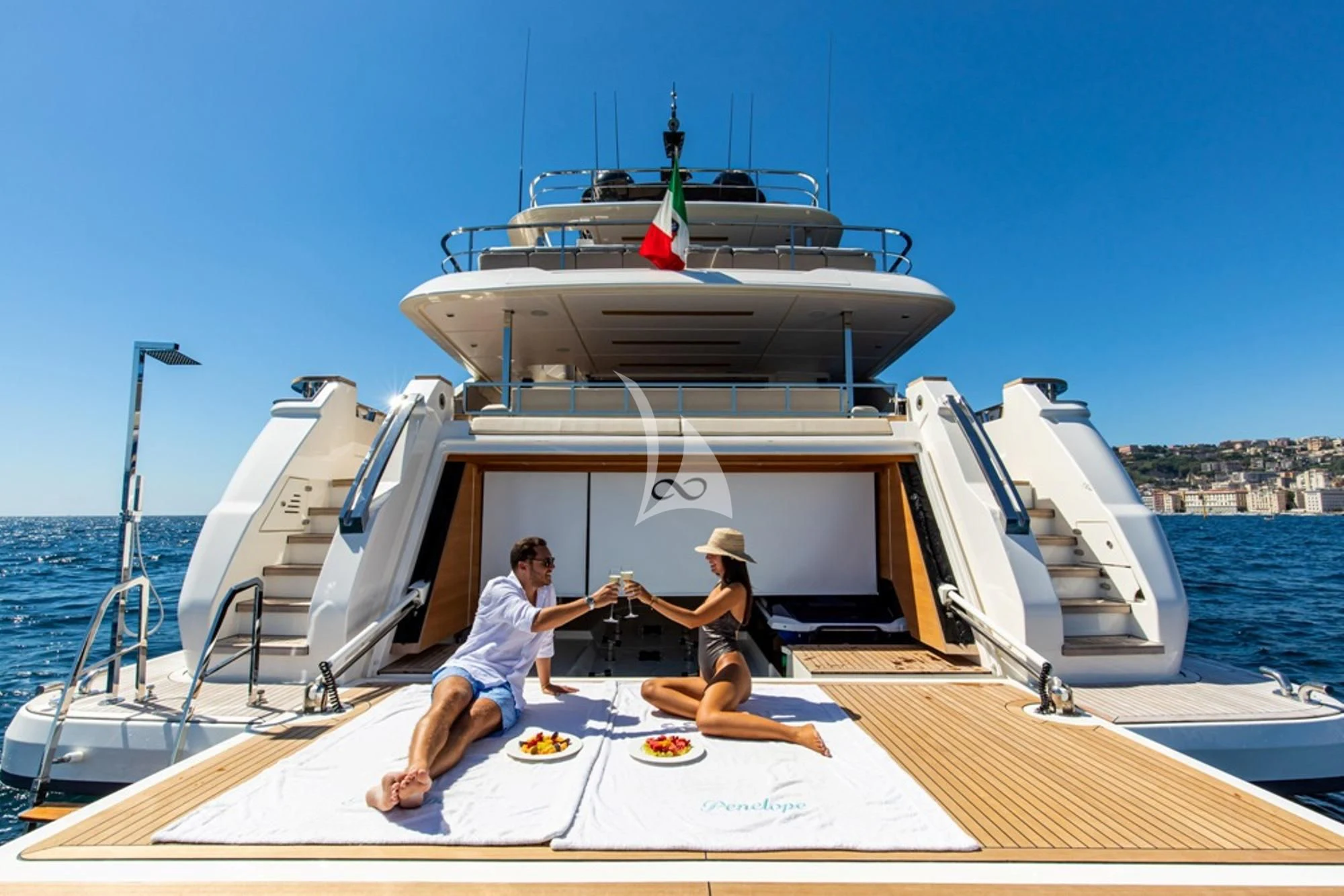 a couple of people sitting on a boat on the water aboard SOUTH Yacht for Sale
