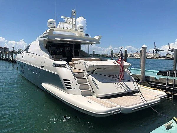 a large white boat on a body of water aboard SEAS THE DAY Yacht for Sale