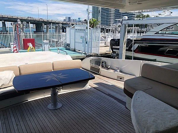 a room with a pool table and couches aboard SEAS THE DAY Yacht for Sale