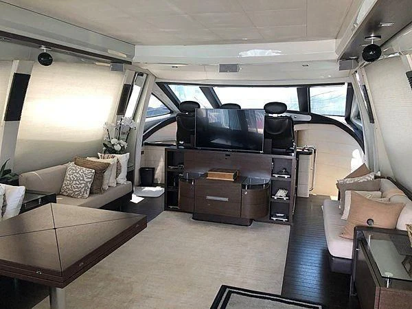 a car with a couch and a tv in it aboard SEAS THE DAY Yacht for Sale