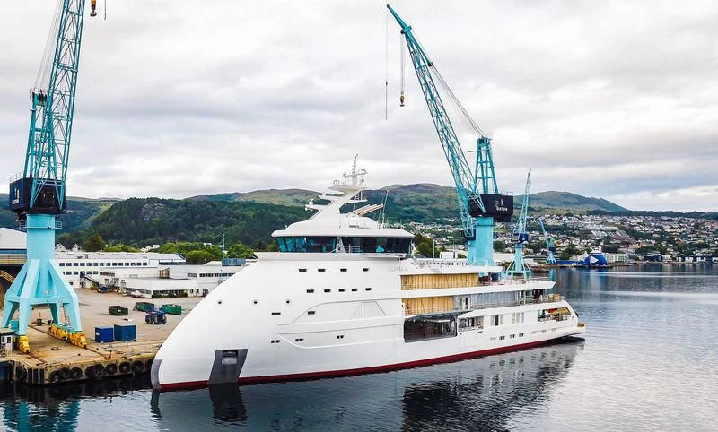 a large white boat in a harbor aboard OLIVIA O Yacht for Sale