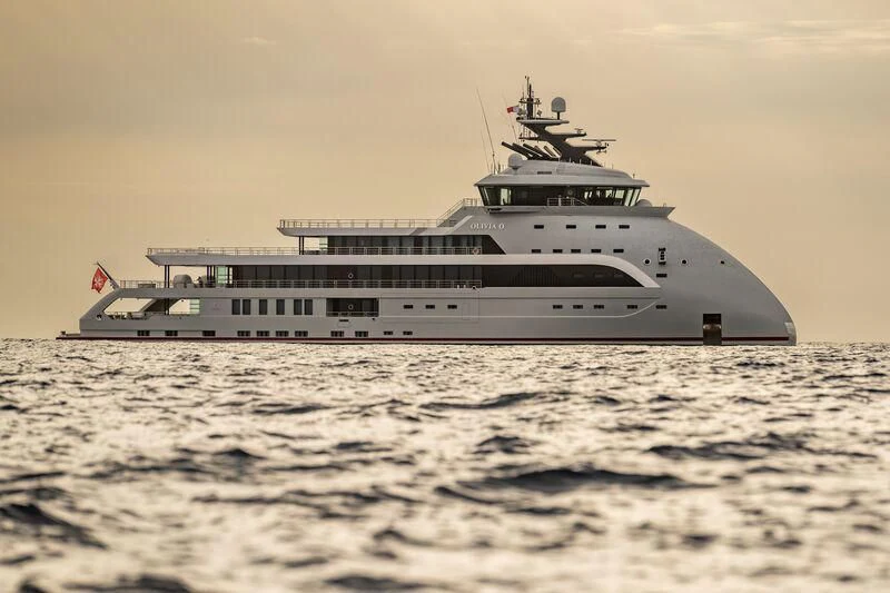 a large ship in the water aboard OLIVIA O Yacht for Sale