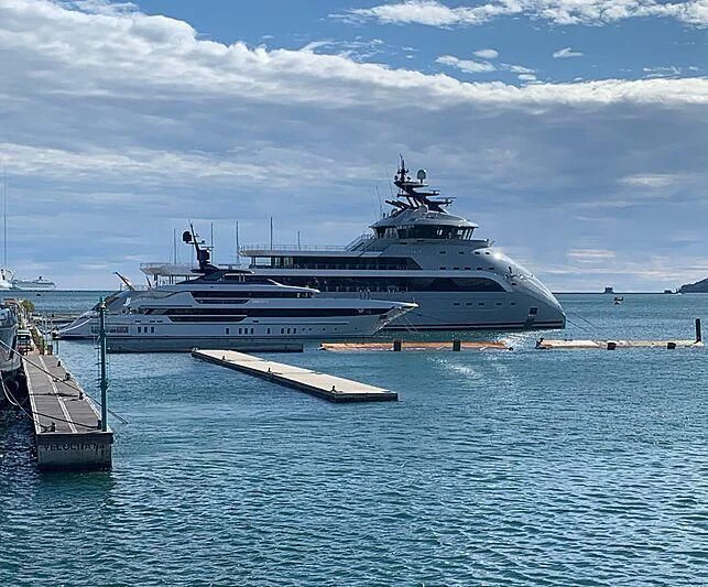 a large cruise ship docked at a pier aboard OLIVIA O Yacht for Sale