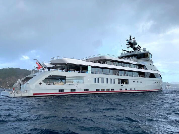 a large white boat on the water aboard OLIVIA O Yacht for Sale