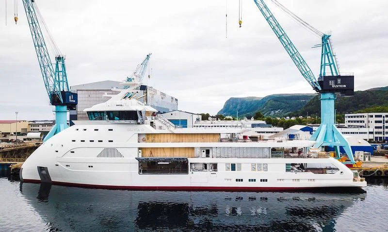 a large white boat in a harbor aboard OLIVIA O Yacht for Sale