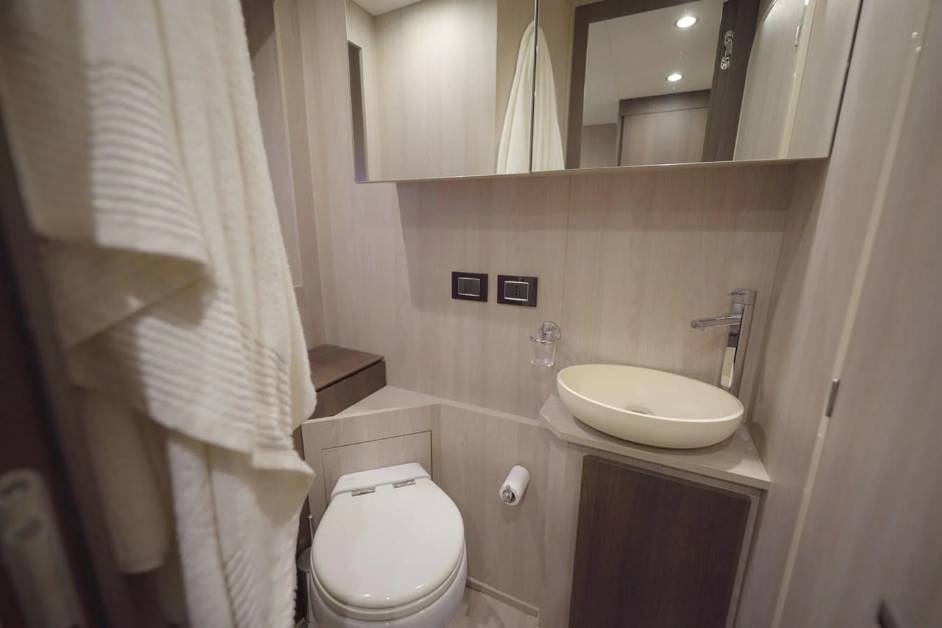 a bathroom with a sink toilet and a bathtub aboard GRANDE 27M Yacht for Sale