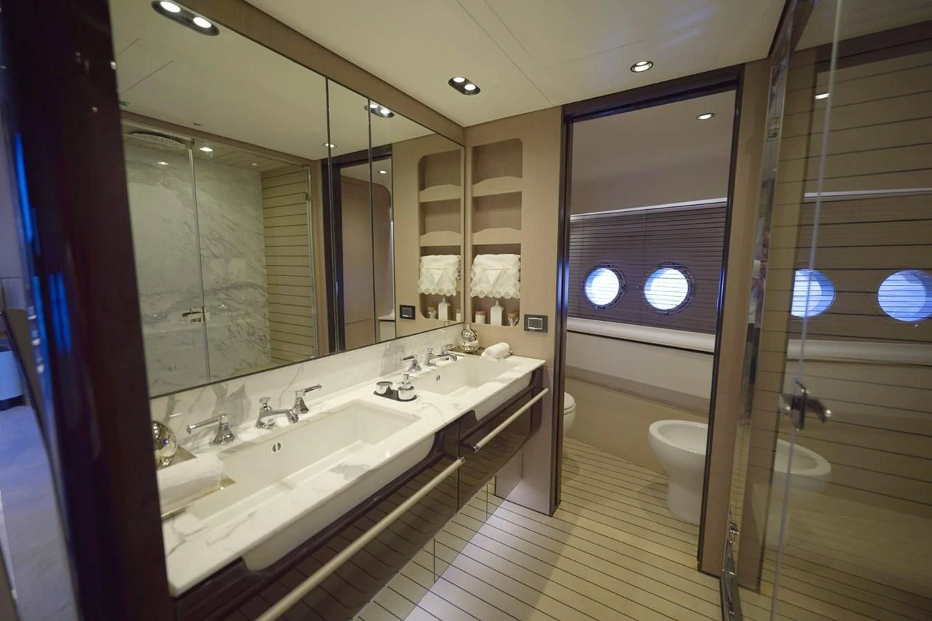 a bathroom with a large mirror aboard GRANDE 27M Yacht for Sale