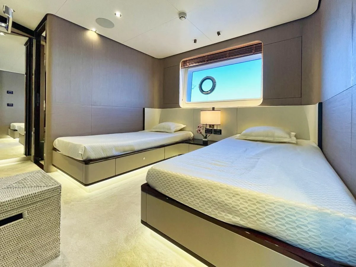 a room with two beds aboard GRANDE 27M Yacht for Sale