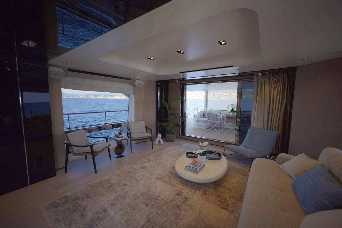 a living room with a large window aboard GRANDE 27M Yacht for Sale