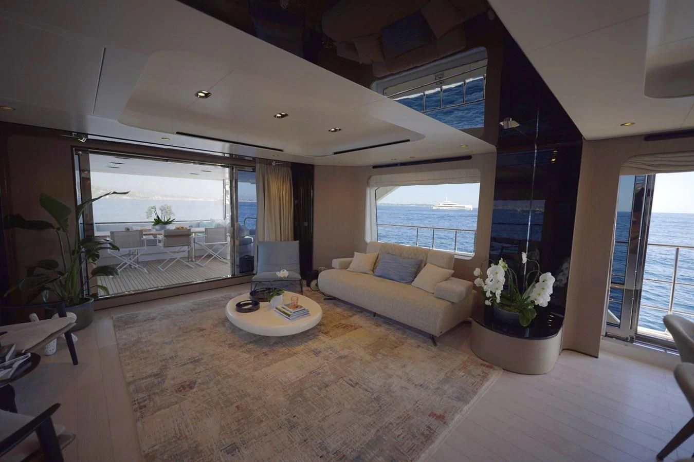 a living room with a large window aboard GRANDE 27M Yacht for Sale