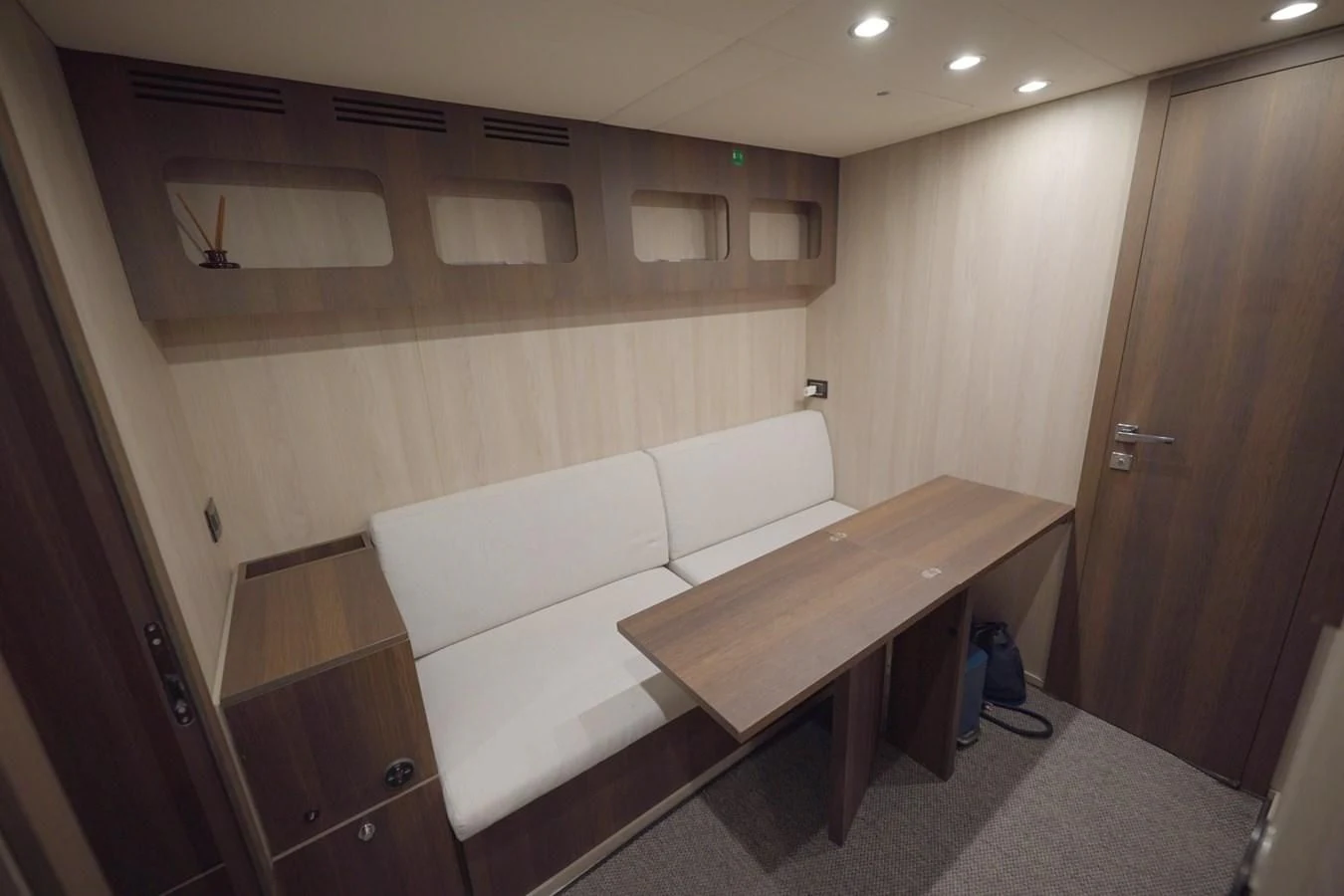 a room with a couch and a table aboard GRANDE 27M Yacht for Sale