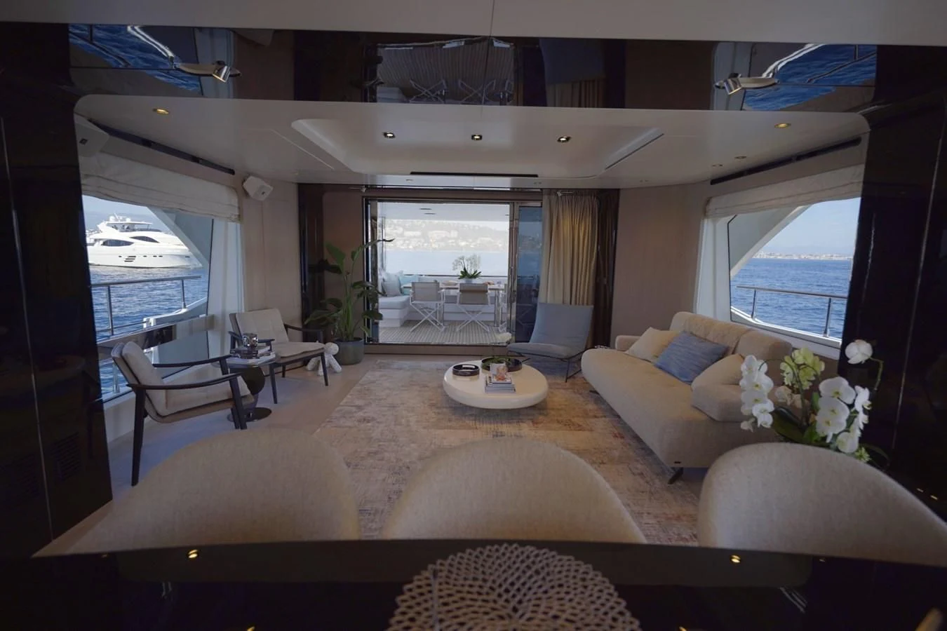 a living room with a large window aboard GRANDE 27M Yacht for Sale