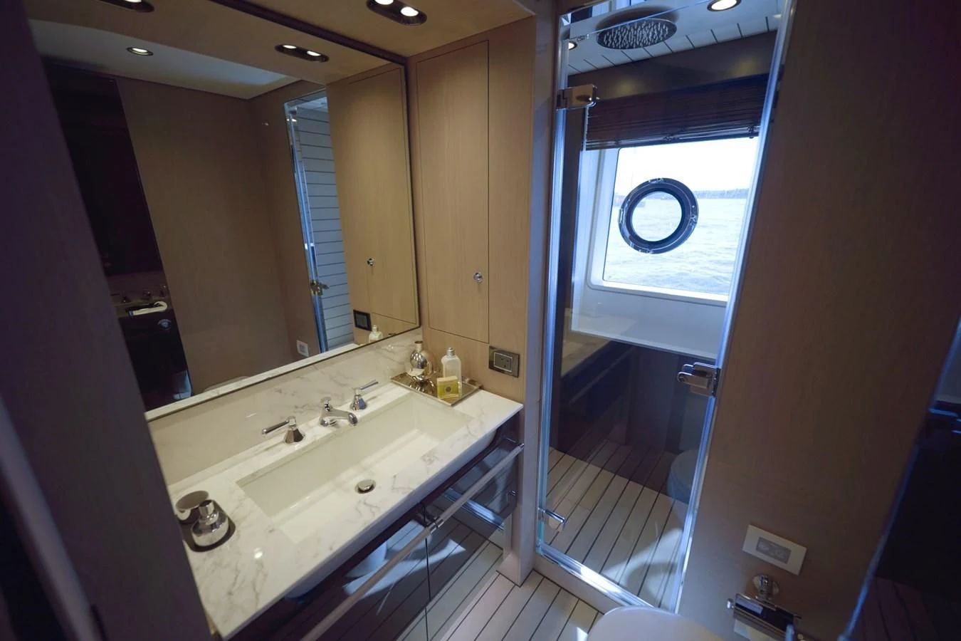 a bathroom with a sink and a mirror aboard GRANDE 27M Yacht for Sale