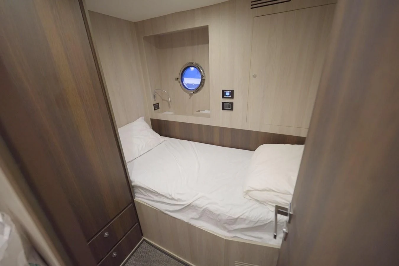 a bed with a mirror above it aboard GRANDE 27M Yacht for Sale
