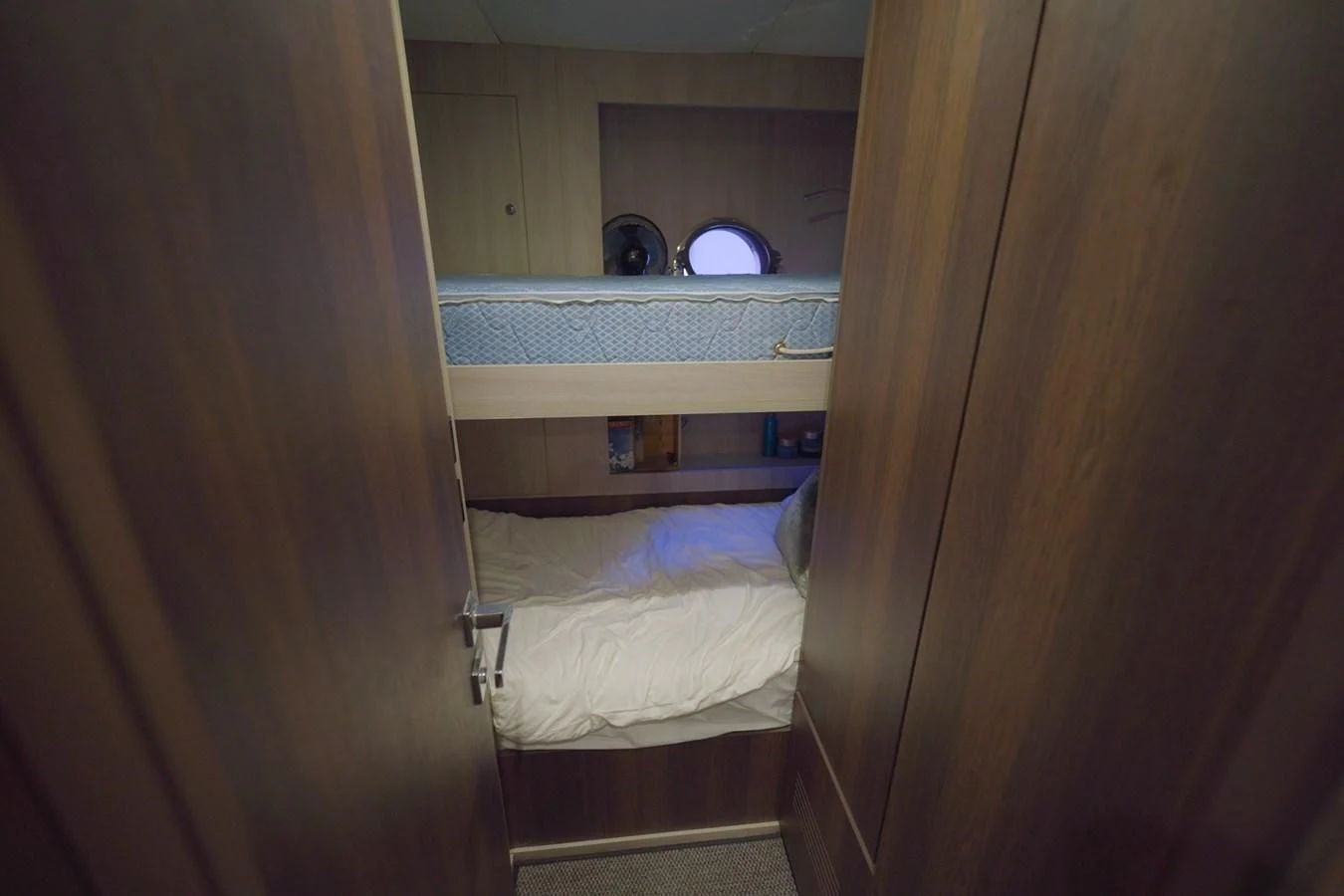 a room with a bed and a window aboard GRANDE 27M Yacht for Sale