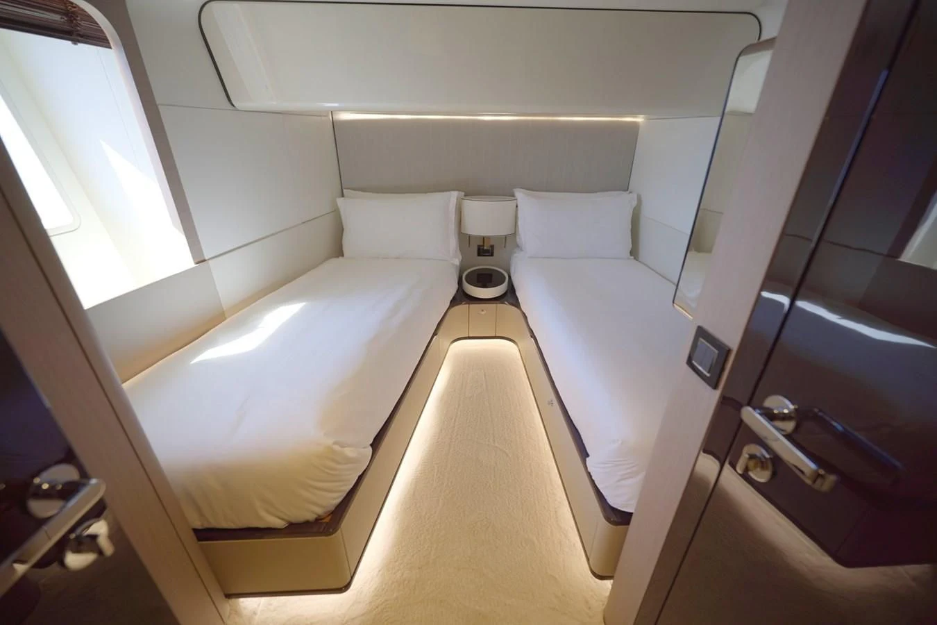 a room with a bed and a window aboard GRANDE 27M Yacht for Sale