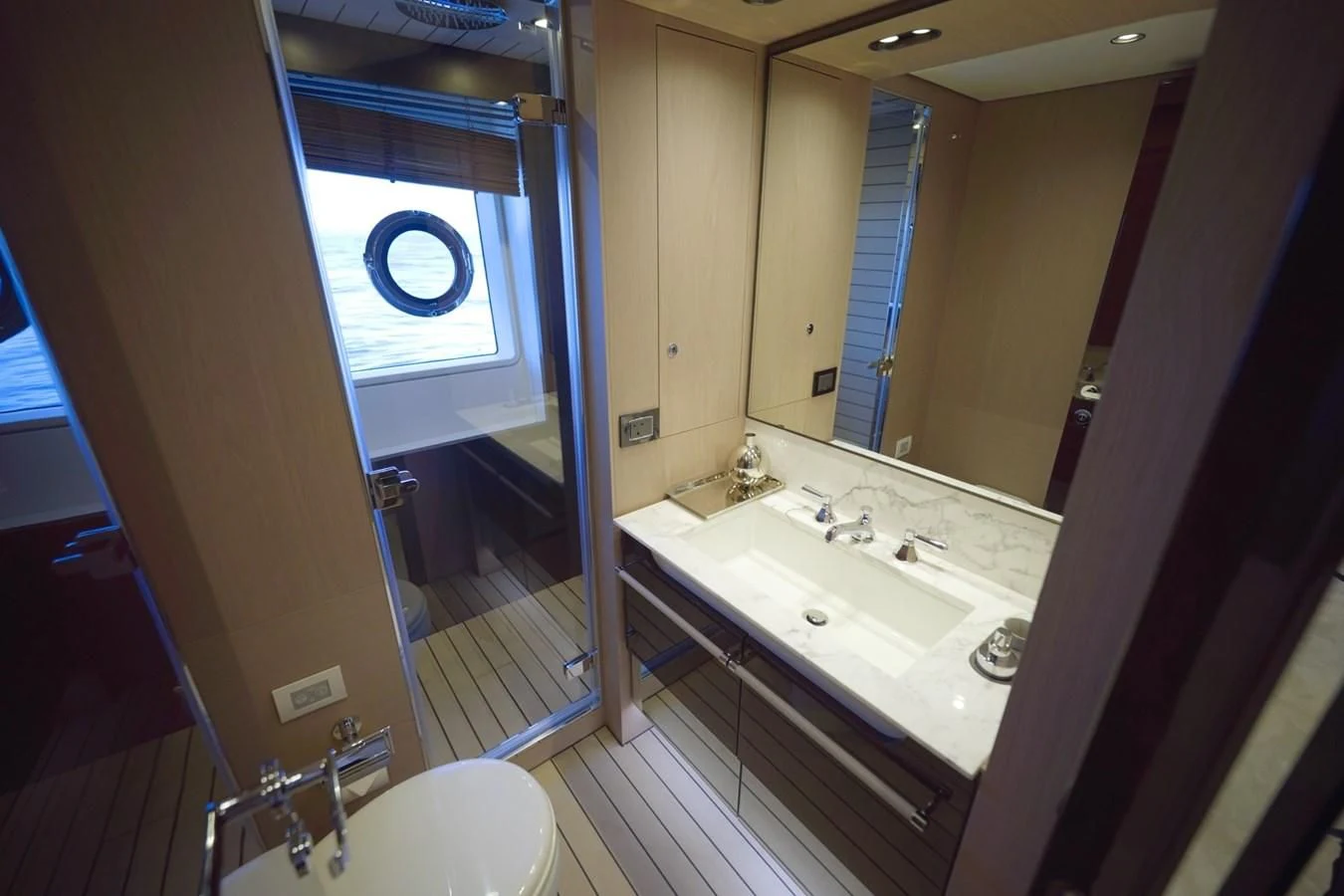 a bathroom with a large mirror aboard GRANDE 27M Yacht for Sale