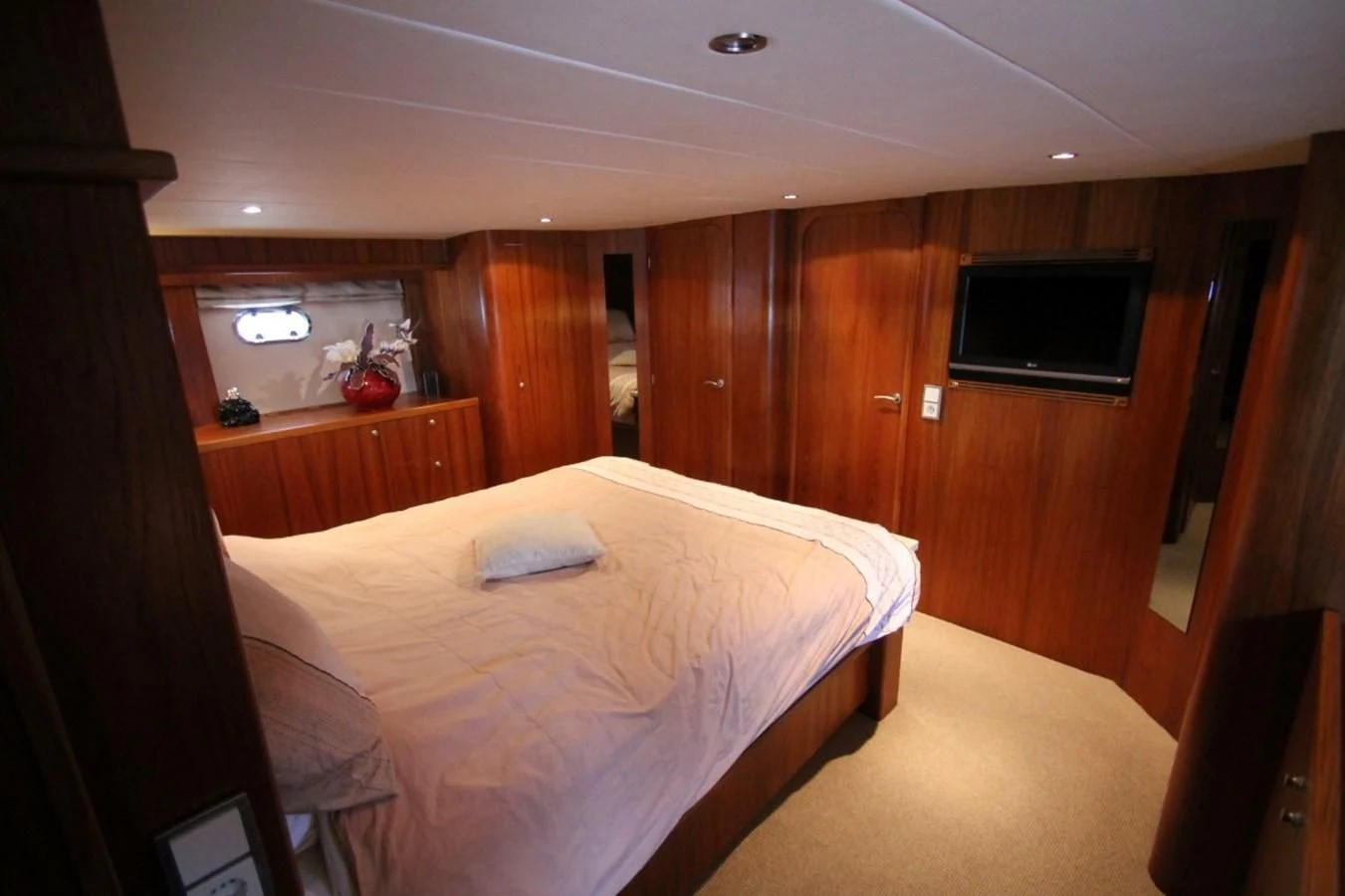 a bedroom with a bed and tv aboard ELISABETH Yacht for Sale