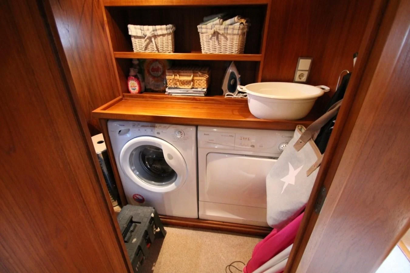 a small kitchen with a washing machine aboard ELISABETH Yacht for Sale