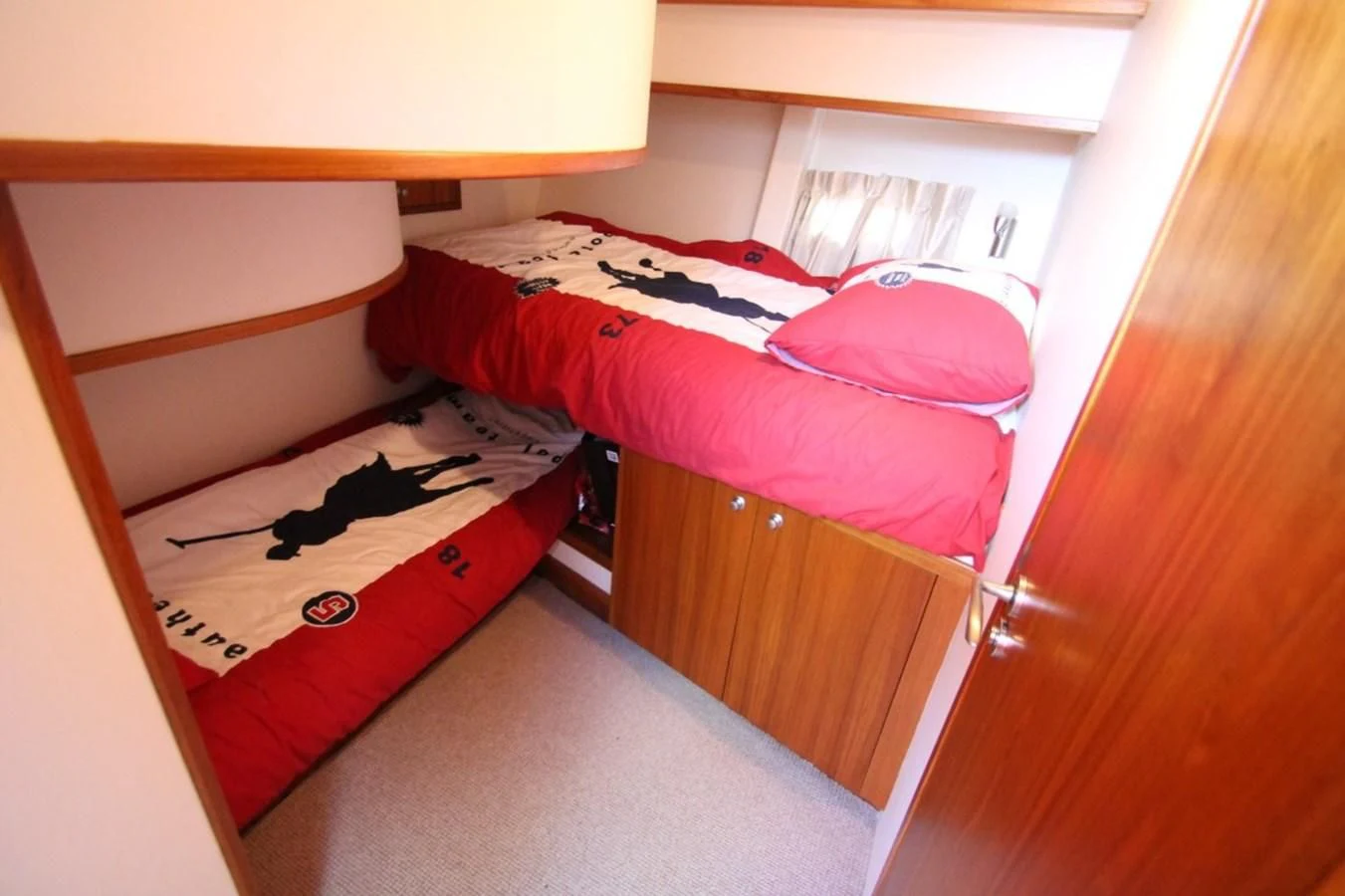 a bed with a red blanket aboard ELISABETH Yacht for Sale