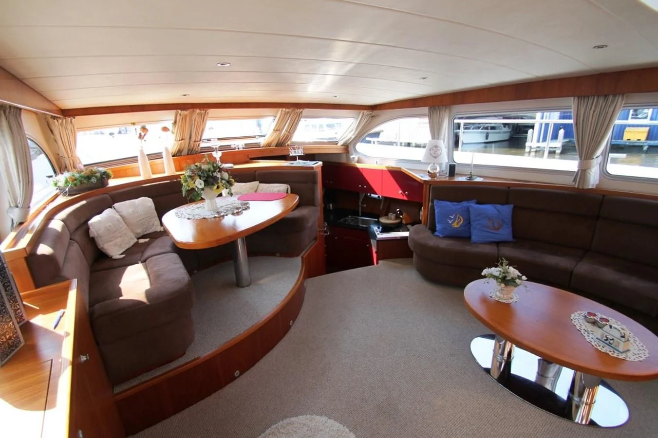 a living room with a table and couches aboard ELISABETH Yacht for Sale