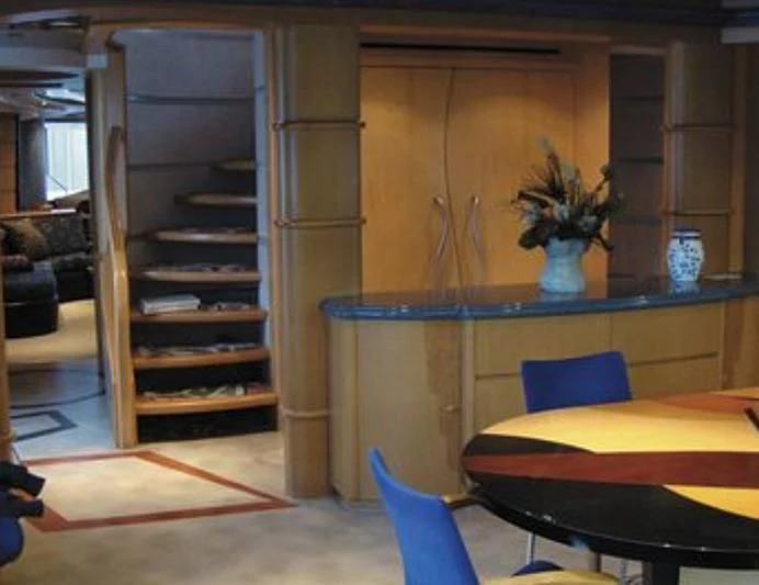 a room with a table and chairs aboard ESTANCIA Yacht for Sale
