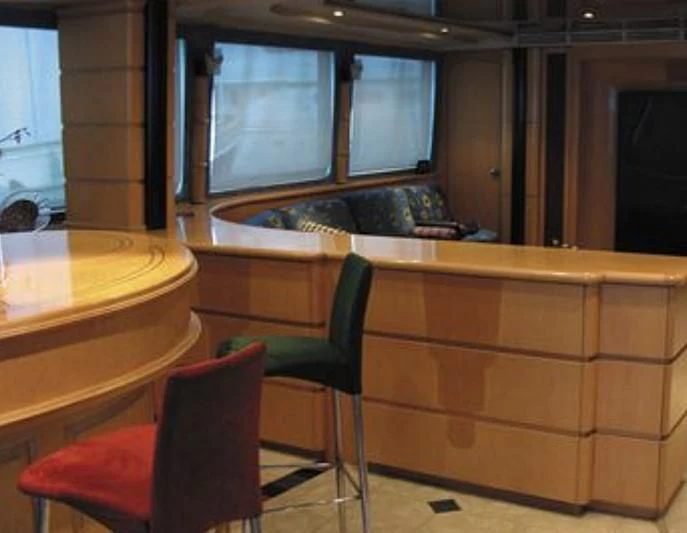 a room with a table and chairs aboard ESTANCIA Yacht for Sale