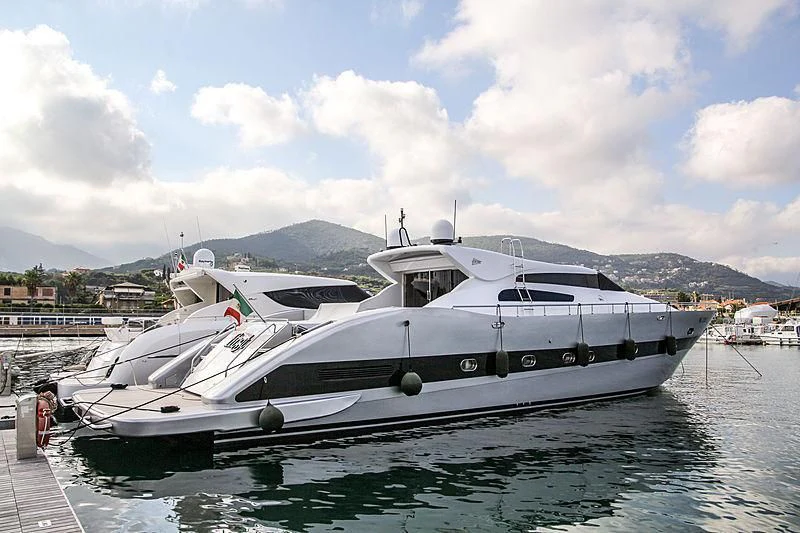 a boat docked at a pier aboard FIRST Yacht for Sale