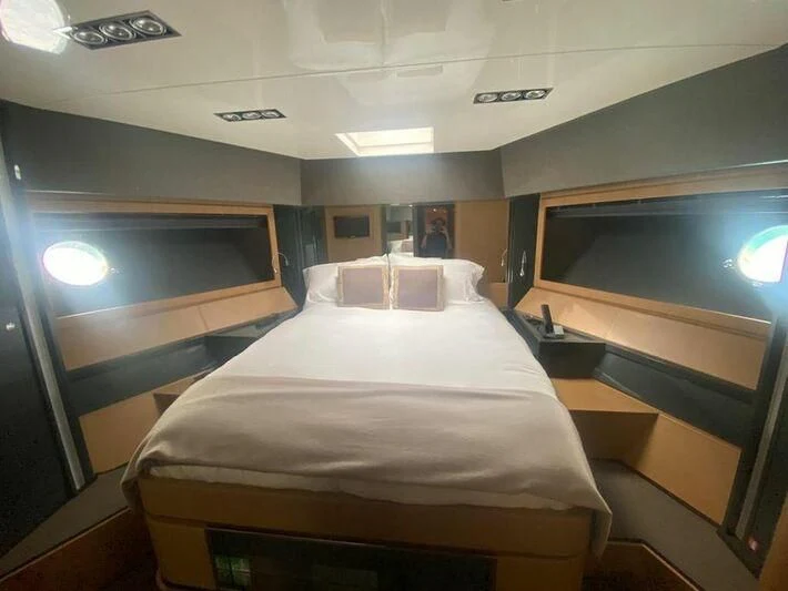 a bed in a room aboard MY PLACE Yacht for Sale