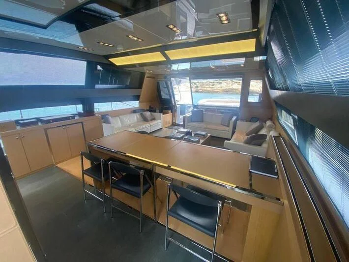 a room with a table and chairs aboard MY PLACE Yacht for Sale