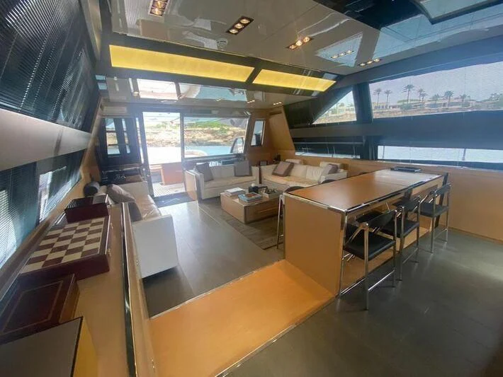 a room with a table and chairs aboard MY PLACE Yacht for Sale