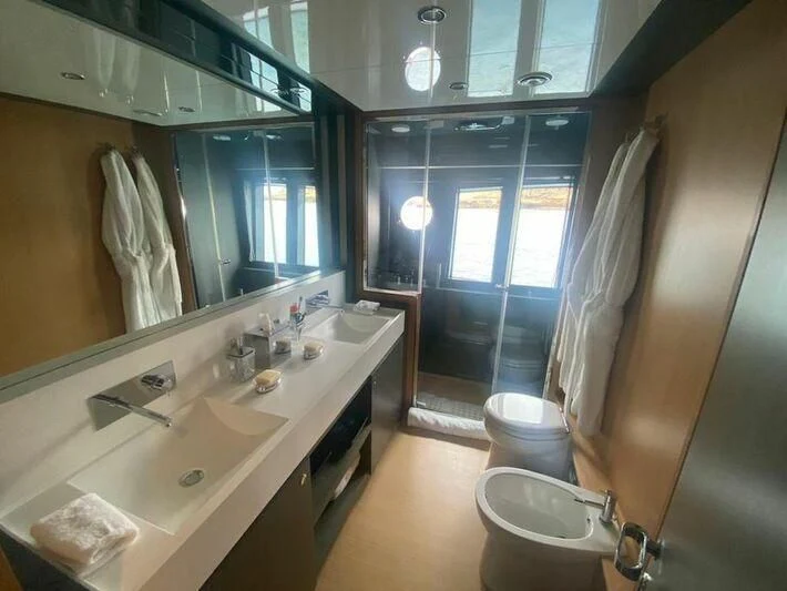 a bathroom with a large mirror aboard MY PLACE Yacht for Sale