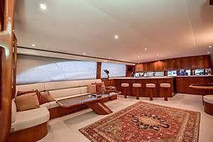 a large living room with a large window aboard CTC Yacht for Sale