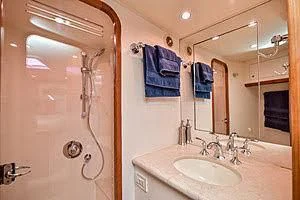 a bathroom with a sink and a mirror aboard CTC Yacht for Sale