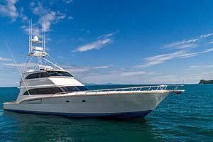 a white boat in the water aboard CTC Yacht for Sale
