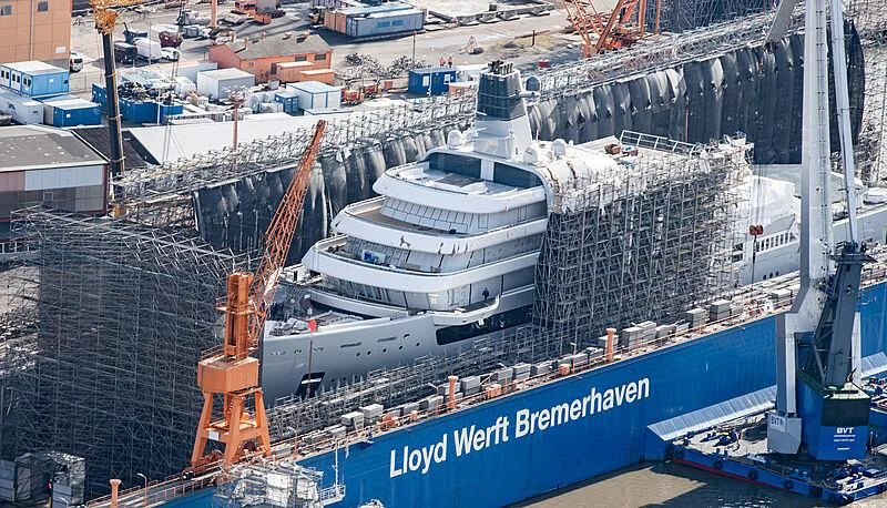 a large ship in a harbor aboard SOLARIS Yacht for Sale