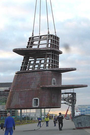 a tall building with a tower aboard SOLARIS Yacht for Sale